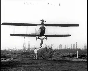 Axel: A Biplane With A Wing Walker Sitting On Top