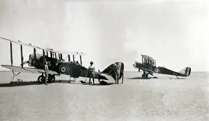 Sepia Images: Two biplanes with resting crew, Iraq