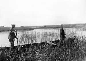 Catchers: Two bird catchers in their boat in the Curonian Spit