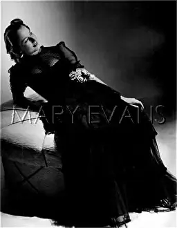 Flouncy: BLACK GOWN WITH FLOUNCES
