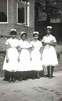 Peel: Four black nurses stand by the hospital wall in Nottingham