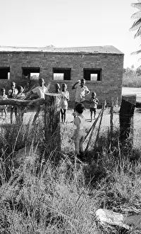 Zanu: Black and white photo of children playing on cattle