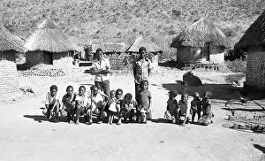 Zanu: Black and white photo of children posing in front