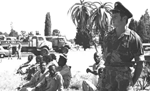 Villon: Black and white photo of group of men looking