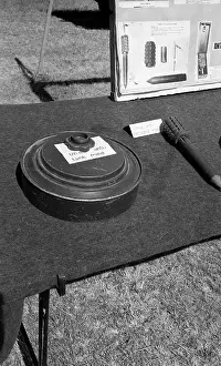 Landmines: Black and white photo of munitions display at