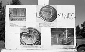 Landmines: Black and white photo of munitions display at