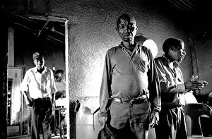 Shebeen: Black and white portrait of a three men at a shebeen
