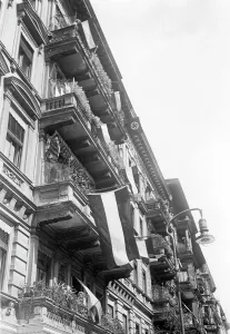 Combination: Black-white-red flags on a residential house, 1932