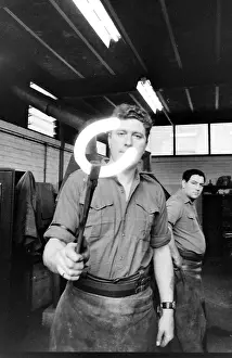 Horseguards: Blacksmith holding up a hot horseshoe