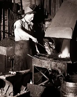 Blacksmithing: Blacksmith Tending Fire in Dark Forge