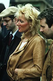Bleached: Bleached blond lady in tan leather jacket