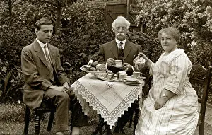 Impaired: Blind man at tea table in a garden