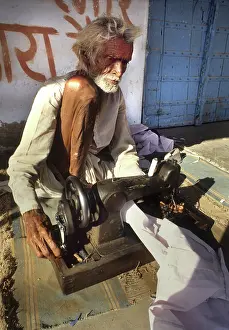 Impaired: A blind man working a sewing machine, Rajasthan, India