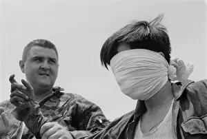 Quang: Blindfolded Viet Cong POW. US Marine Sergeant ?