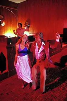 Pht001: Blonde Couple on Disco Dance Floor Doing the Hustle