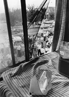 Speck: Bloodstained nurses cap on a bed where eight student