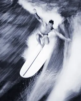Manly: Blurred Action of Man Riding Wave on