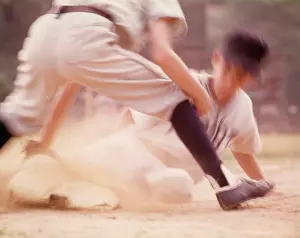 Baseman: Blurred Motion Little League Baseball Boy Sliding into
