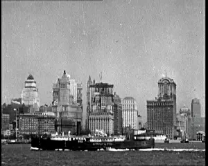 Riverfront: Boat Sailing Past the Riverfront Of Manhattan