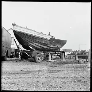Bollard: A boat on a trailer on the west bank of the River Bure