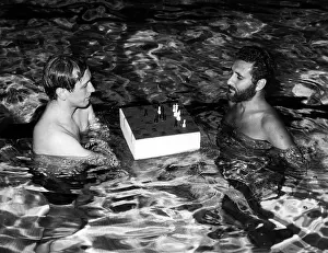Chessboard: Bobby Fischer plays a chess match with ?