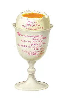 Eggcup: Boiled egg in an eggcup on a cutout New Year card