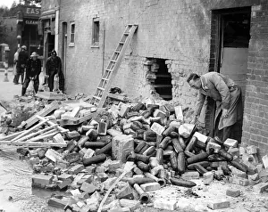 Salvaging: Bomb damage in a London suburb, WW2