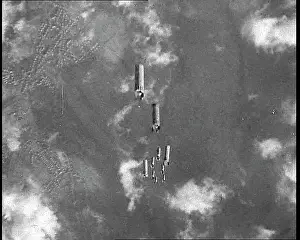 Dropping: Bombs Dropping From the Open Bomb Bay Of An