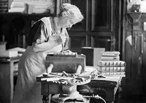 Gilding: Bookbinder gilding the spine, 1938