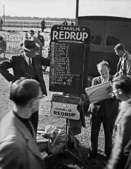 Punters: Bookmaker and punters at racecourse