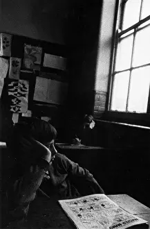 Noticeboard: Two bored boys in a classroom