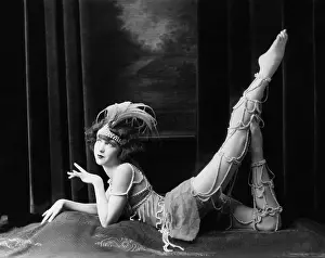 Bead: Bored dancer posing in beaded costume