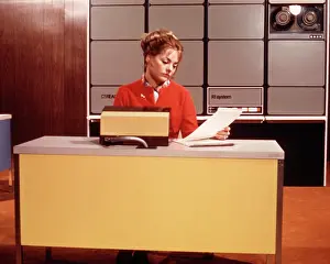 High Tech: Bored Expressionless Woman Reading Papers Sitting at Yell