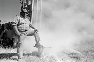 Borehole: Borehole drilling. A White man standing in front