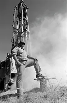 Borehole: Borehole drilling. A White man standing in front