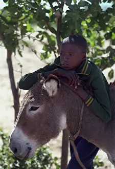 Kalahari: Botswana, Kalahari, 2001: A young San boy with his