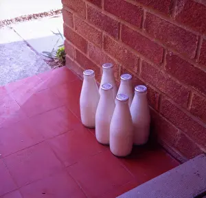 Alan Greeley Collection: Six bottles of silver-top milk on the doorstep