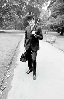 Hatted: Bowler-hatted City gent in a park
