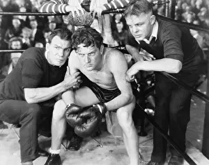 Intent: Boxer in corner with trainers
