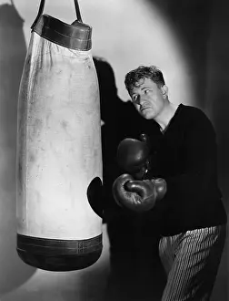 Frown: Boxer using punching bag