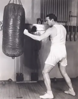 Athleticism: Boxer working out at gym
