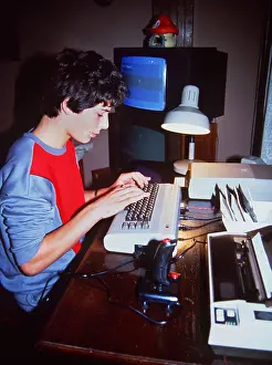 Computers: BOY ON 80S COMPUTER