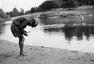 Krish: Boy arranging a fishing line and float