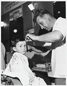 Hairdresser: BOY AT A BARBER'S SHOP