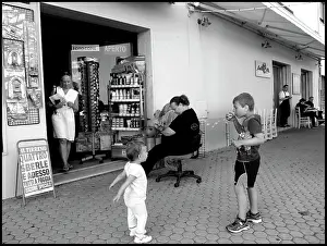 Bubbles: Boy blowing bubbles Italian street