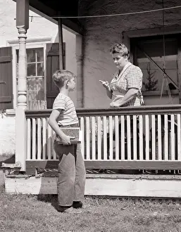 Admonishing: Boy Carrying Books Just Leaving for School and