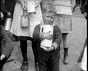 Clutching: A Boy Clutching A Jug To His Chest and Crying