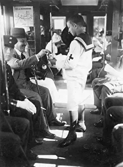 Collects: Boy collects for the German Red Cross, 1914