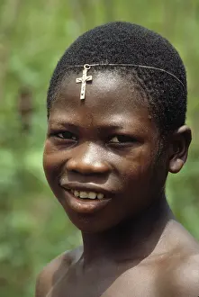 Freetown: Boy with crucifix on his forehead, Sierra Leone