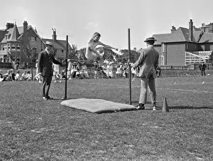 Loudspeaker: Boy doing high jump at athletics event